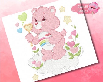May include: Pink Care Bear with a rainbow on her belly holding a jar of hearts and a wand with a heart on the end. She is standing on a cloud with hearts and stars around her. The text "Candy Designs" is in the upper right corner of the image.