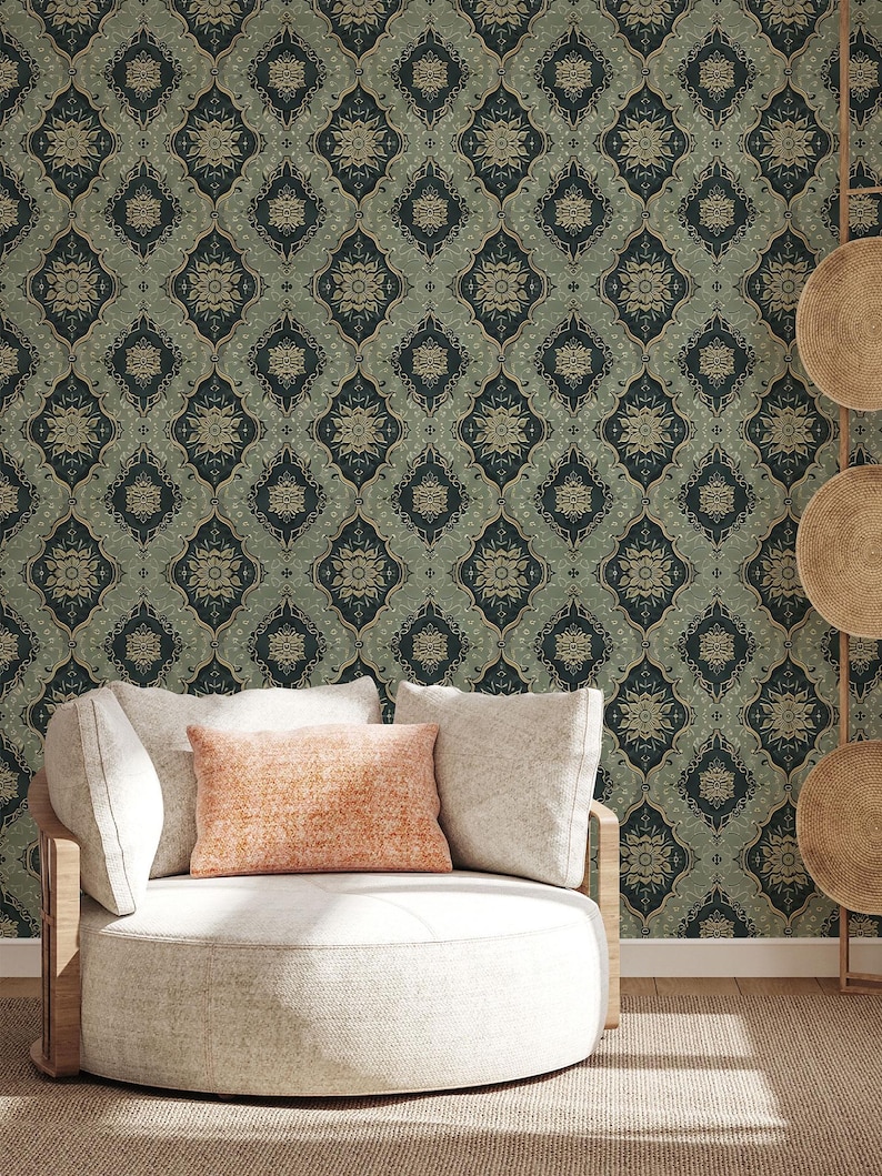 May include: A round white chair with a light orange pillow sits in front of a wall covered in a dark green and gold patterned wallpaper.