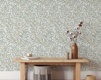 May include: A wooden bench with a woven seat and a wicker basket underneath. The wall behind the bench is covered in a wallpaper with a repeating pattern of green leaves and branches.