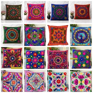 May include: A collection of square throw pillows with intricate embroidered designs. Each pillow features a unique pattern with vibrant colors like red, blue, green, and pink. The designs include floral and geometric motifs, adding a decorative touch to any space.