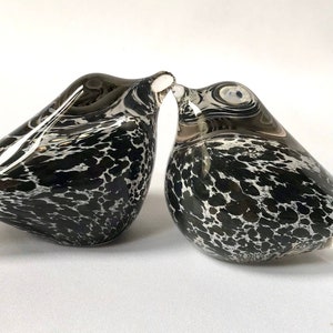 a pair of blown glass spotted birds