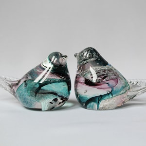 A pair of glass bird figurines