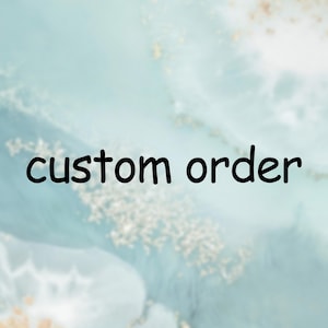 May include: A light blue background with a white and gold marbled pattern. The text "custom order" is written in black.