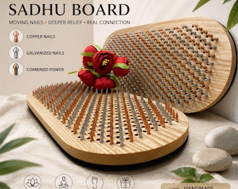 May include: A wooden Sadhu board featuring rows of copper and galvanized nails, with text reading DYNAMIC SADHU BOARD, MOVING NAILS, DEEPER RELIEF, REAL CONNECTION, and HANDMADE WOODEN BOARD BUILT TO LAST, accented by a cluster of red flowers.