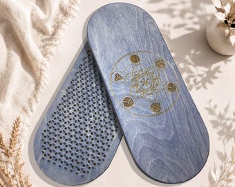 May include: Two oval-shaped blue wooden boards with a smooth finish. One board features a gold-colored geometric Metatron's Cube design, while the other is covered in a dense grid of small, dark, upright metal nails arranged in a precise pattern.