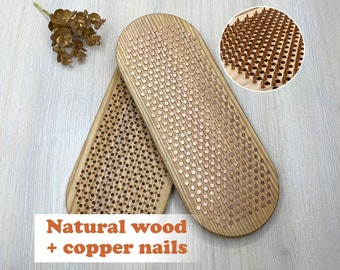 May include: Two wooden sadhu boards with copper nails. The boards are oval-shaped and feature evenly spaced copper nails. The text "Natural wood + copper nails" is displayed in an orange font at the bottom of the image. A close-up shows the nail detail.