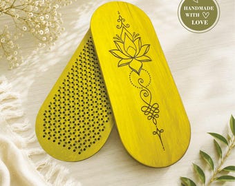 May include: Two oval-shaped wooden boards with a bright yellow finish. One board features a dense grid of small metal nails on its surface, while the other displays a black laser-engraved lotus flower and ornamental design with the text HANDMADE WITH LOVE.