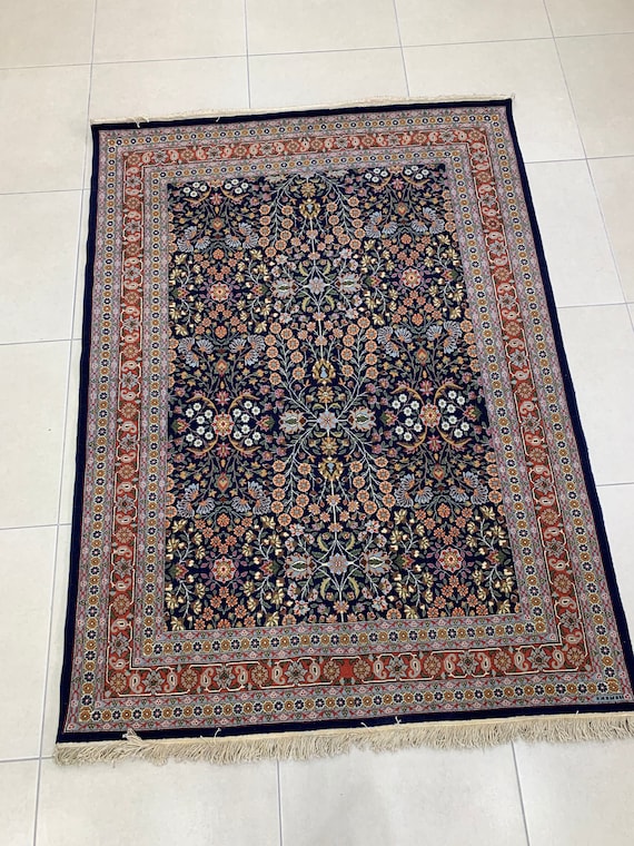 London | A Turkish silk Hereke rug, Signed AK for Arto
