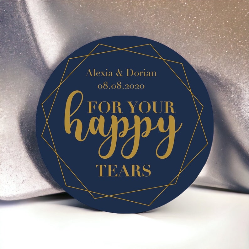 May include: A navy blue circle with a gold geometric frame. The text "Alexia & Dorian 08.08.2020 FOR YOUR happy TEARS" is written in gold.