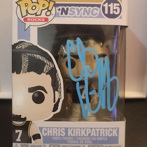 May include: A Funko Pop Rocks vinyl figure of Chris Kirkpatrick from NSYNC, number 115, inside its original display box. The clear plastic window features a light blue autograph across the front. The box displays the name and number 7.