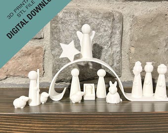 Puede incluir: Escena de la natividad impresa en 3D en blanco con una estrella, un ángel y figuras de María, José, el niño Jesús, un pastor, una oveja, un burro y un conejo. Las figuras están dispuestas en semicírculo alrededor de un pesebre.