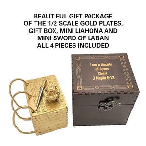 May include: A wooden box with a gold inscription that reads "I am a disciple of Jesus Christ 3 Nephi 5:13". The box contains a set of gold plates, a miniature Liahona, and a miniature sword of Laban.