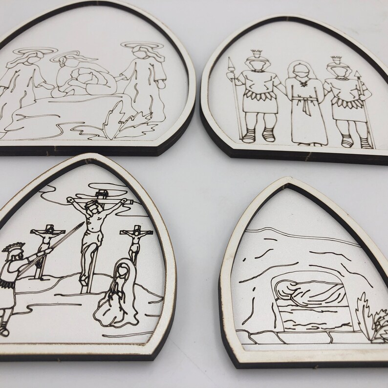May include: Set of four black and white illustrations depicting scenes from the story of Jesus Christ. The illustrations are printed on white wooden plaques with a black border. The scenes include Jesus being crucified, Jesus being buried, Jesus appearing to Mary Magdalene, and Jesus appearing to the disciples.