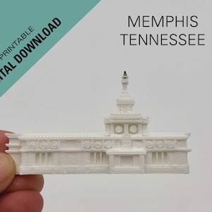 May include: White 3D printed model of a building with a tall tower. The model is labeled "MEMPHIS TENNESSEE" and is a digital download, 3D printable.