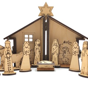 May include: A wooden nativity scene set with a brown wooden stable, a star on top, and 15 figures including Mary, Joseph, baby Jesus, three wise men, a donkey, a camel, a cow, a sheep, and a shepherd. The figures are all standing on small wooden bases.