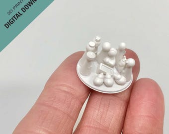 Puede incluir: Escena de la Natividad impresa en 3D en blanco con una estrella en la parte superior, que representa al niño Jesús, María, José y los tres reyes magos. Las figuras están dispuestas en círculo alrededor de un pesebre.