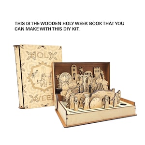 May include: A wooden Holy Week book with a pop-up scene depicting the events of Jesus's last week. The book is closed on the left and open on the right, revealing the pop-up scene. The book is made of wood and has a light brown finish. The pop-up scene is made of wood and has a light brown finish. The scene depicts Jesus on the cross, surrounded by people. The book is a DIY kit.