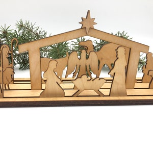Slotted Silhouette Nativity made from wood. 13 Nativity pieces plus the stand and storage box.