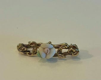 Vintage light pink and green ceramic flower with goldtone metal pin.