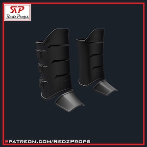 May include: A pair of black shin guards with a futuristic design. Each guard has a shin plate and a lower foot guard. The guards are secured with three buckles. The Redz Props logo is in the top left corner, and the Patreon link is at the bottom.