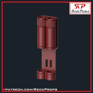 May include: A red plastic double-barrel holder with two slots for holding small cylindrical objects. The holder has a rectangular base with two slots on the bottom and two slots on the top.