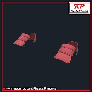 Op de afbeelding: Twee rode plastic stukken met een gesegmenteerd ontwerp, die lijken op een harnas of een kostuumstuk.