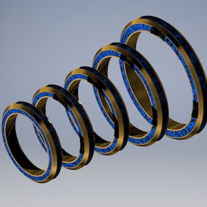 May include: A series of gold-colored rings with a blue patterned interior, arranged in a descending spiral. The rings have a metallic sheen and are set against a light blue background. The design suggests a modern, abstract theme.