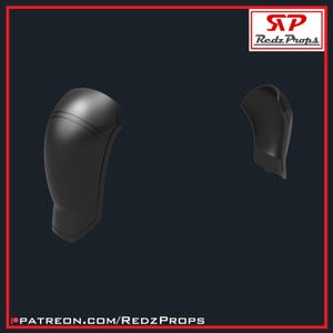 May include: Two black plastic pieces, possibly for a costume or prop. The pieces are shaped like the upper part of an arm, with a rounded top and a flat bottom.