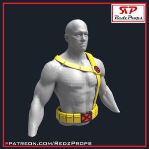 May include: A gray mannequin torso wearing a yellow harness and utility belt. The harness features a circular red and black X-shaped emblem on the left shoulder. The belt includes a central rectangular red and black X-shaped buckle.