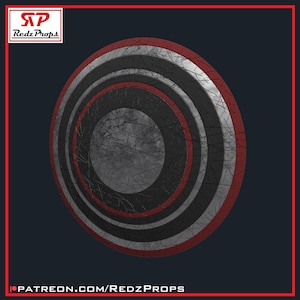 May include: A circular shield with a distressed metallic appearance. The design features concentric circles in black, white, and red, with a central gray circle. The shield has a textured, worn look, suggesting battle damage. The text "Redz Props" is in the upper left corner.