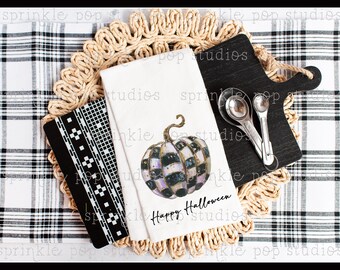 May include: A white kitchen towel with a black and white checked pumpkin design and the text "Happy Halloween".