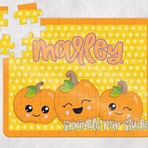 May include: A yellow jigsaw puzzle with a star pattern and the name "Maxley" in purple letters. There are three orange pumpkins with happy faces on them. The text "Sprinkle Pop Studios" is at the bottom of the puzzle.