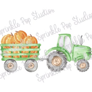 May include: A green toy tractor pulling a wagon filled with orange pumpkins. The tractor has black wheels and a green cab. The wagon has a green wooden frame and black wheels.