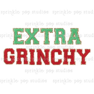 May include: A green and red glitter design with the text "EXTRA GRINCHY" in a bold, blocky font.