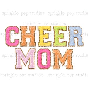 May include: Cheer Mom in colorful glitter letters with gold outlines. The letters are in a varsity style font.