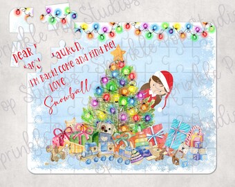 May include: A Christmas-themed jigsaw puzzle featuring a girl hiding behind a decorated Christmas tree. The puzzle has a blue background with snowflakes and the text "Dear Santa, I'm back! Come and find me! Love, Snowball".