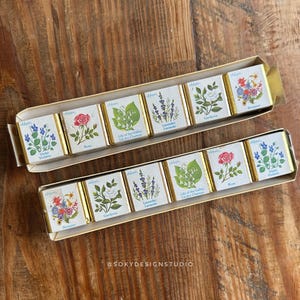 May include: A set of three ceramic vases in varying heights and shapes. The vases are white with a matte finish and feature a minimalist design. They are suitable for displaying flowers or as decorative accents.