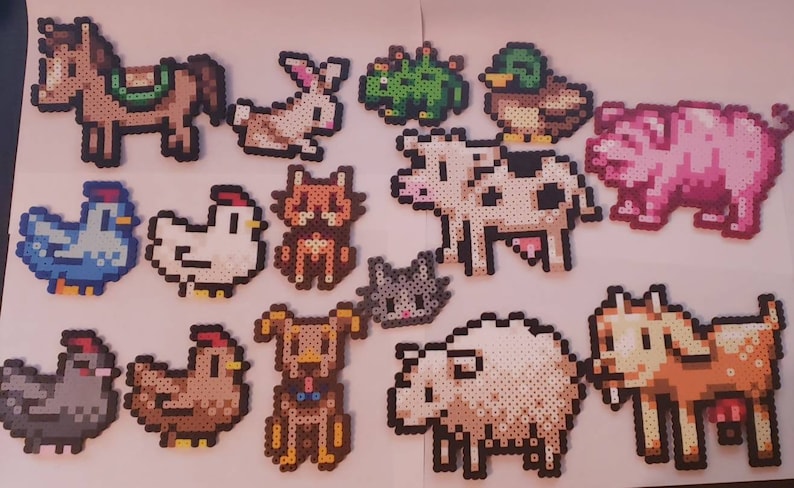 May include: A collection of pixel art farm animals, including a horse, rabbit, frog, duck, pig, chickens, cat, cow, dog, sheep, and goat. Each animal is crafted from small, colorful beads, creating a charming, retro aesthetic.