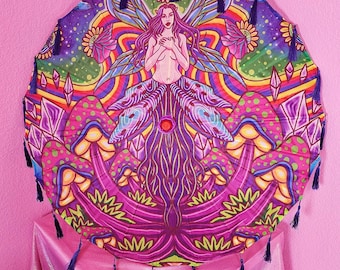 May include: A colorful, psychedelic-themed umbrella featuring a central illustration of a woman with purple hair and wings. The design incorporates mushrooms, crystals, and rainbow patterns. The umbrella has a scalloped edge with dark blue tassels.