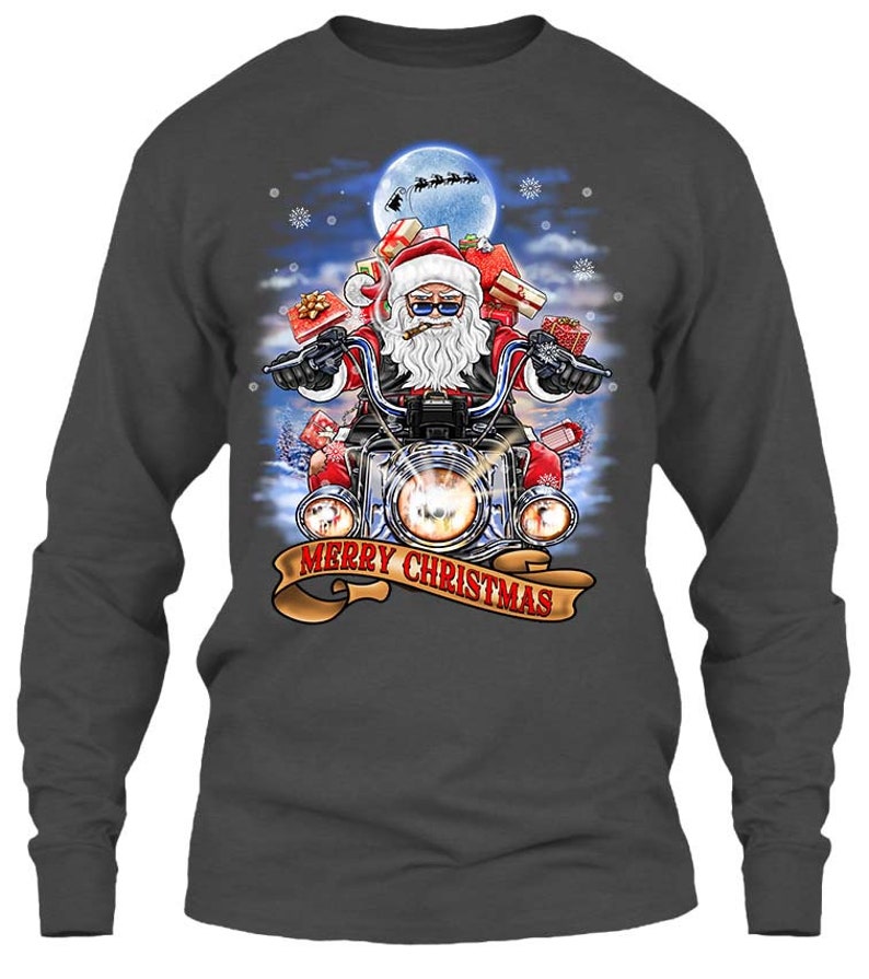 May include: Dark gray long-sleeve shirt featuring a graphic of Santa Claus riding a motorcycle, carrying gifts. The design includes a full moon, snowflakes, and the text "MERRY CHRISTMAS" on a banner.