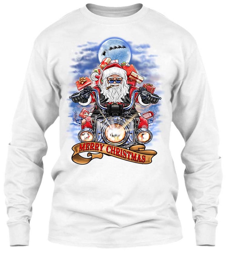 May include: White long-sleeve shirt featuring a graphic of Santa Claus riding a motorcycle, carrying gifts, and smoking a cigar. The design includes a banner that reads "MERRY CHRISTMAS" and a full moon in the background.