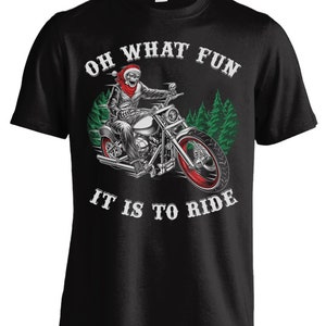 May include: Black t-shirt with a white graphic of a skeleton riding a motorcycle with the text "Oh What Fun It Is To Ride".