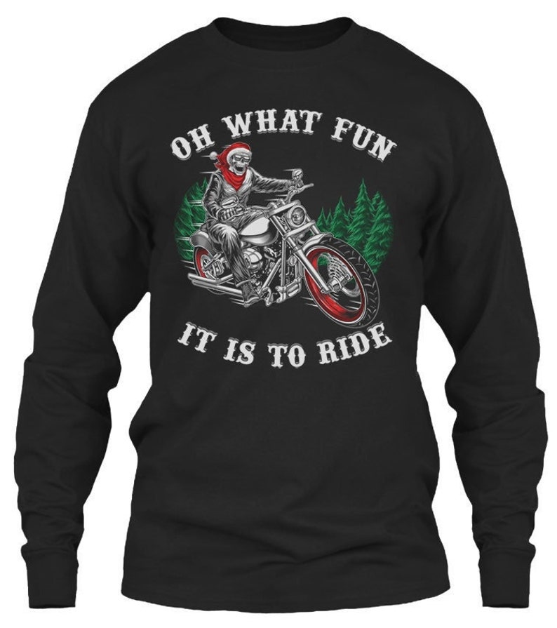 May include: Black long-sleeve t-shirt with a skeleton riding a motorcycle wearing a Santa hat. The text "Oh What Fun It Is To Ride" is printed on the shirt.