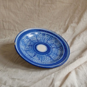 A Vintage North African Plate with Blue and White Sun Motif