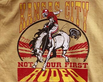 KC Chiefs, Kansas City, KC Not our First Rodeo short sleeve, Chiefs player Riding a Bronco, KC Rodeo tee
