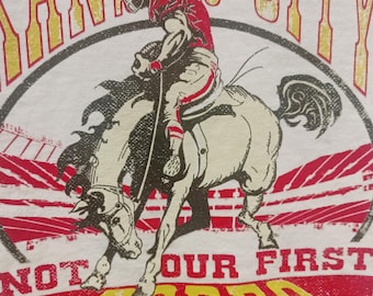 KC Chiefs Ivory tee, Kansas City, KC Not our First Rodeo short sleeve, Chiefs player Riding a Bronco, KC Rodeo tee