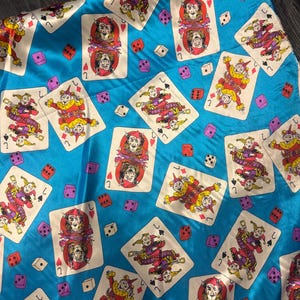 1m turquoise multi coloured joker  print satin dress fabric 58&quot; wide
