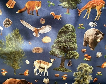 May include: A blue fabric with a repeating pattern of woodland animals, trees, and mushrooms. The animals include a fox, a deer, a bear, an owl, and a squirrel. The trees are green and brown, and the mushrooms are red and white.