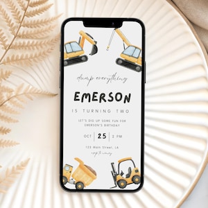 May include: A digital invitation on a smartphone screen for a second birthday. The design features yellow construction vehicles, including excavators and a forklift, with the text "dump everything" and "Emerson is turning two."