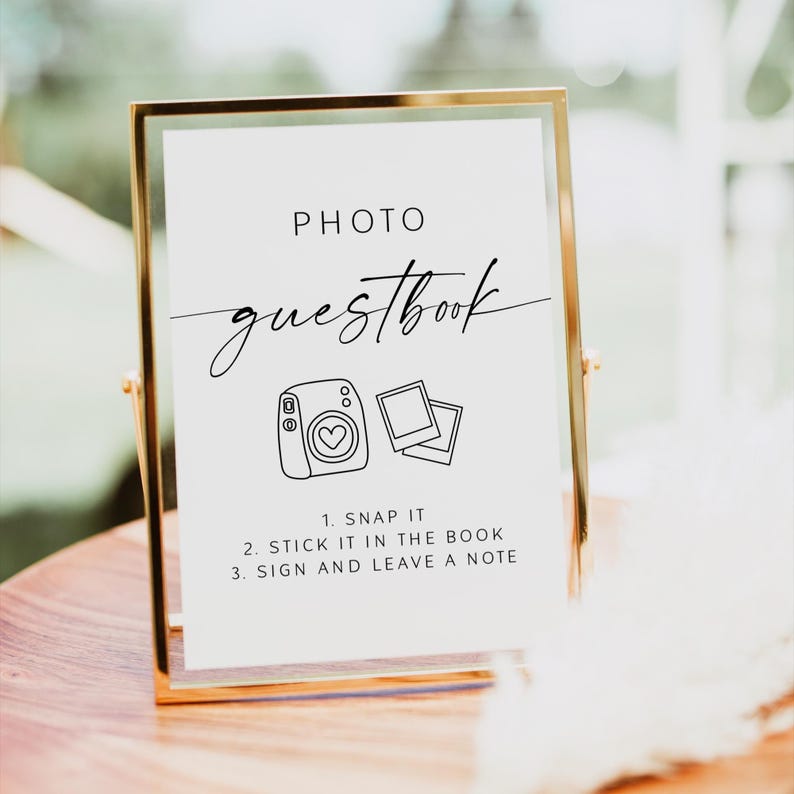 Create a fun and memorable experience for your guests with this stylish Photo Guest Book Sign, perfect for your Polaroid guest book table or instant‑camera station. This printable sign invites guests to snap a photo, shake it, and leave a note, helping you capture candid moments and heartfelt messages you’ll treasure long after the wedding day.